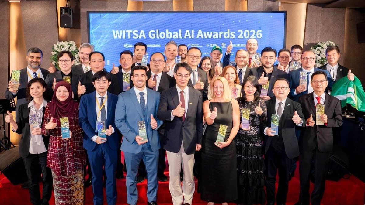 Award winners holding trophies on stage in front of a WITSA Global AI Awards 2026 screen
