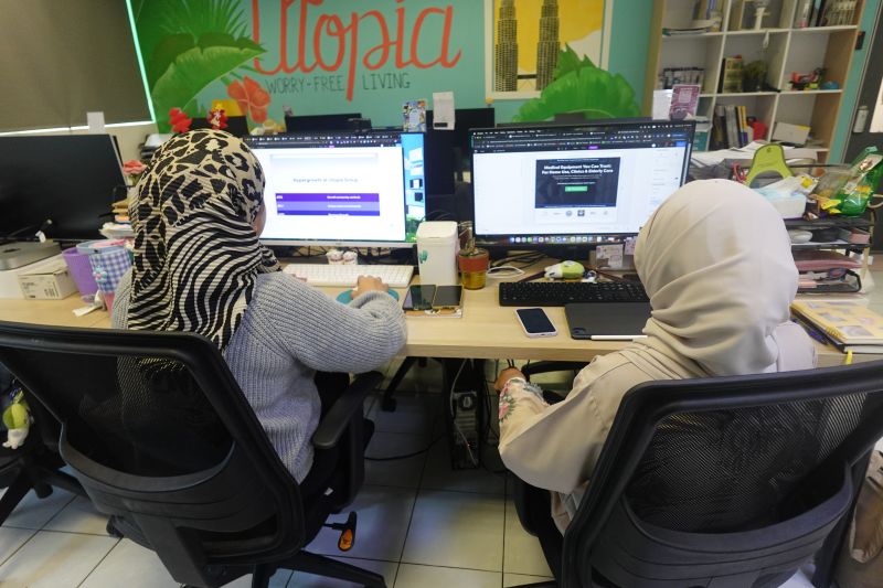 Team members working at Utopia office