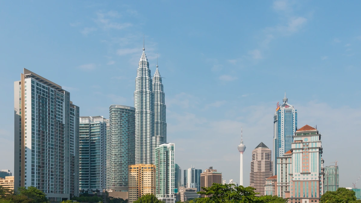 The Kuala Lumpur skyline with office towers seen from a pedestrian flyover on Jalan Tun Razak