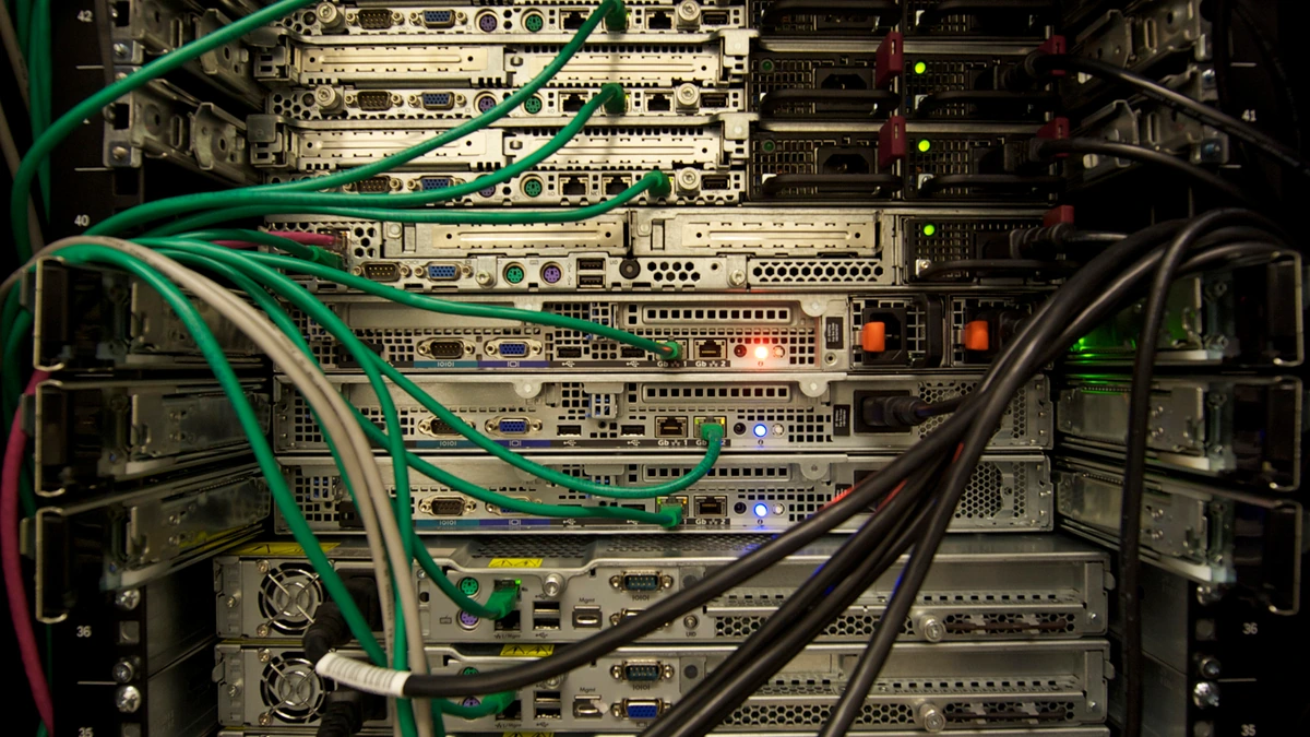 Cables connect servers in a rack photographed at a general computing facility