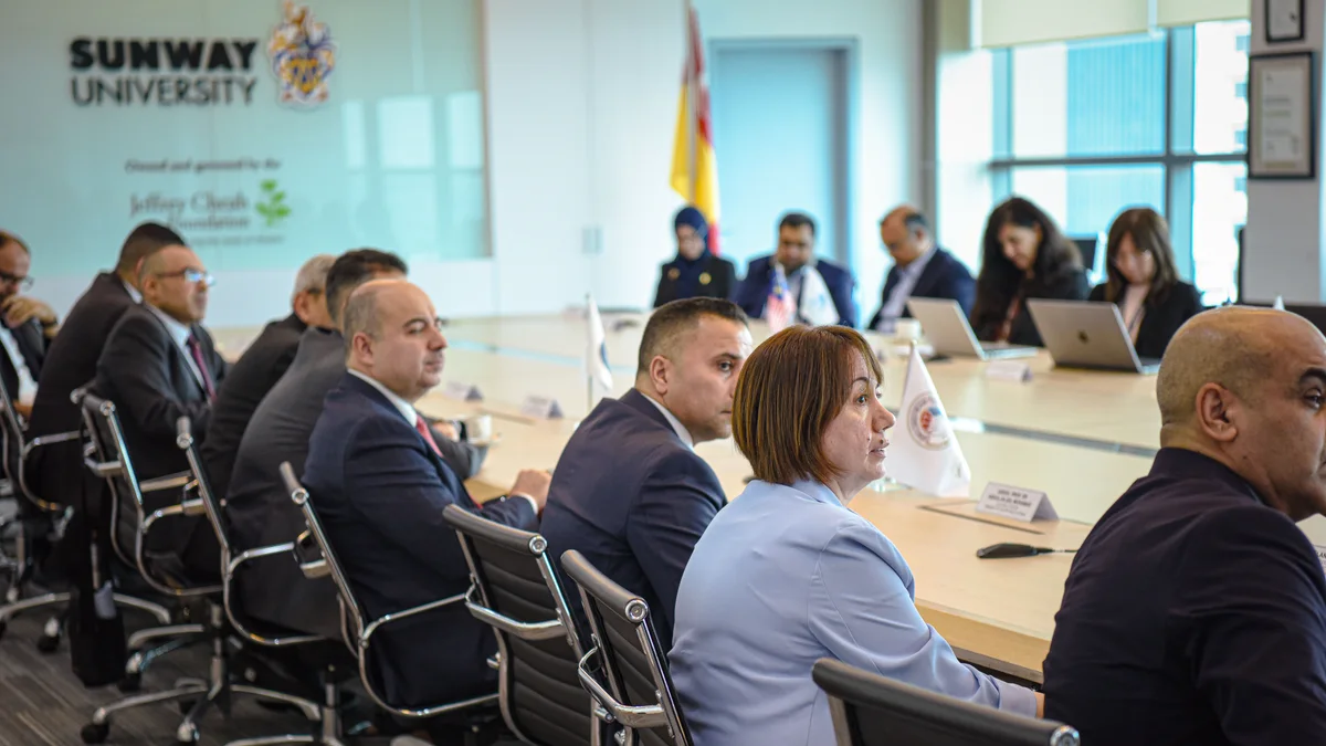 Sunway and Iraqi delegates seated around a university meeting table